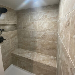 Beige tile walk-in bathroom shower